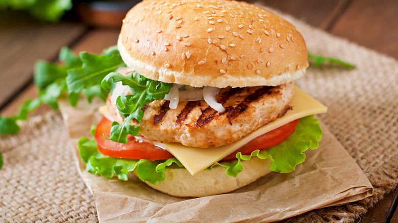 juicy turkey burger on a bun with lettuce, tomato and cheese