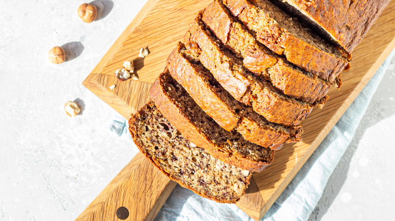 Sliced banana bread on a wooden board