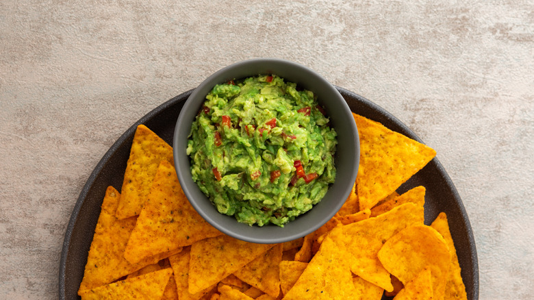 Guacamole in bowl and chips