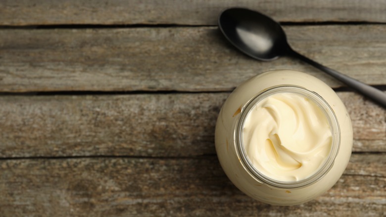 Mayonnaise in a jar and spoon