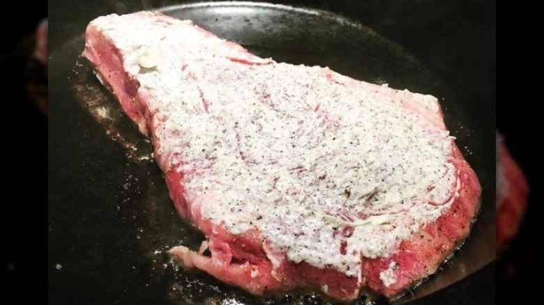Steak coated in mayo 