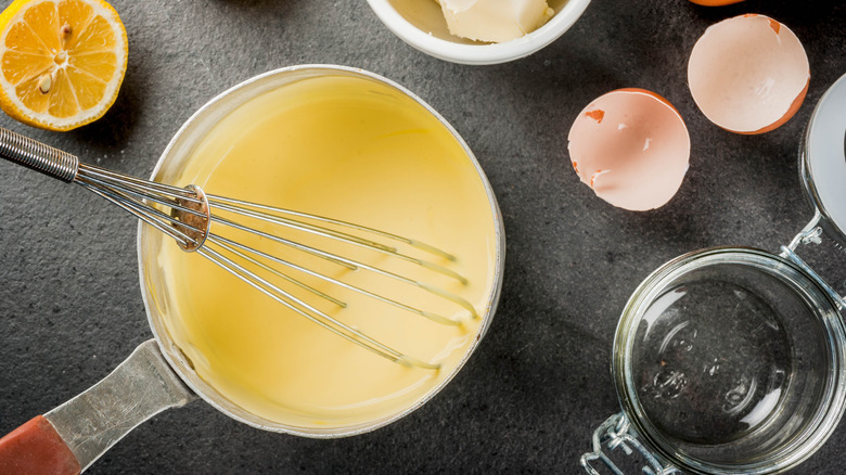 Whisking hollandaise sauce in pot