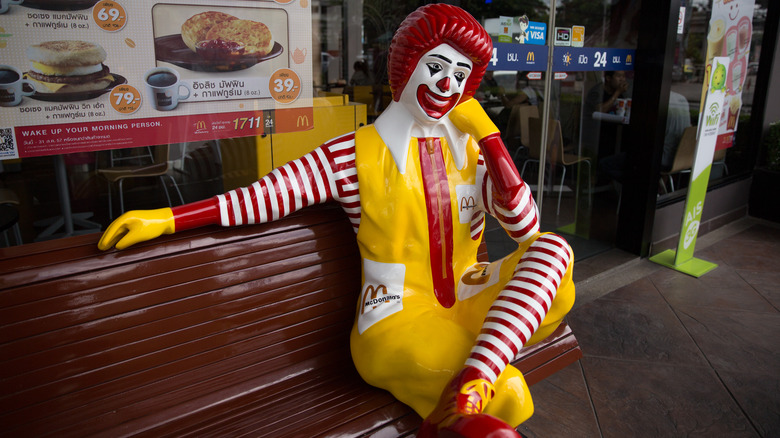 Ronald McDonald statue on bench