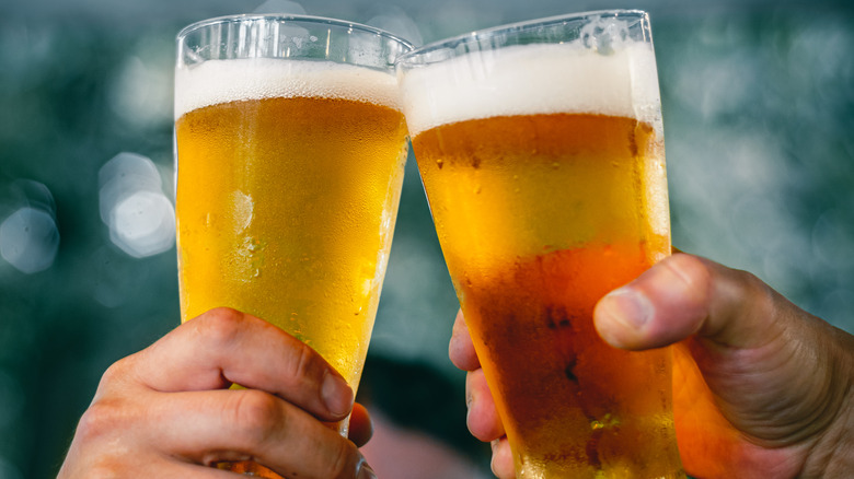 People toasting glasses of beer