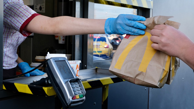 McDonald's worker gives customer food