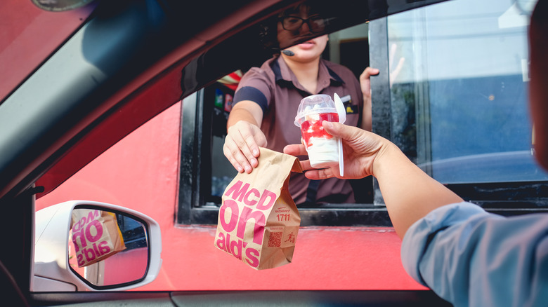 McDonald's drive thru food being handed out the window