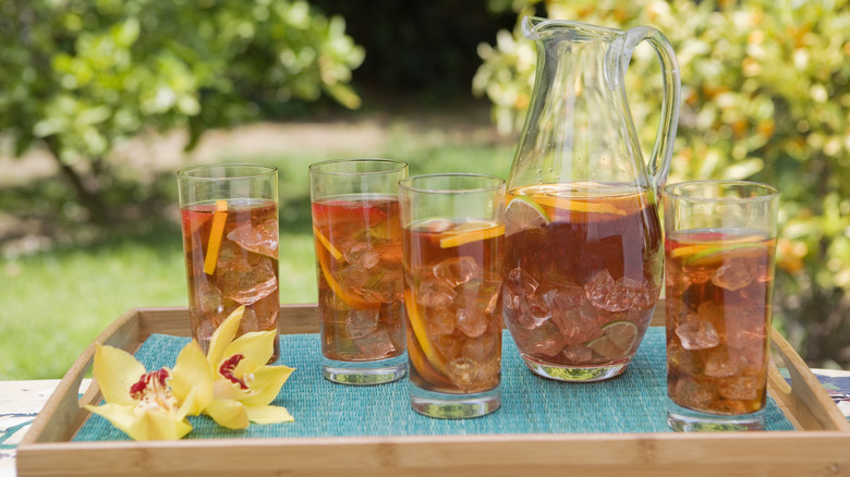 Iced tea in a pitcher with glasses