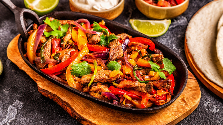 A skillet of fajitas, which is a Tex-Mex staple