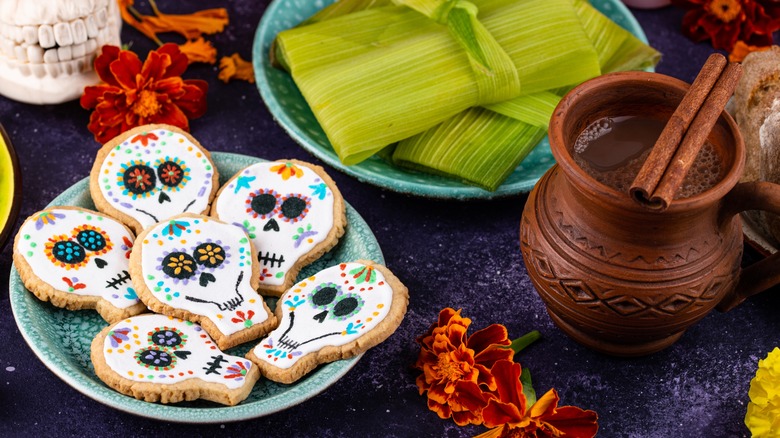 Dia de los Muertos skull cookies, tamales, and hot chocolate