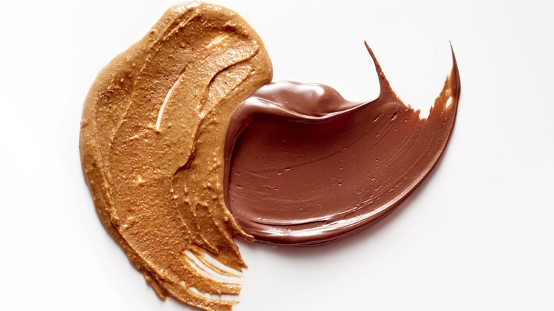  smear of chocolate next to a smear of peanut butte