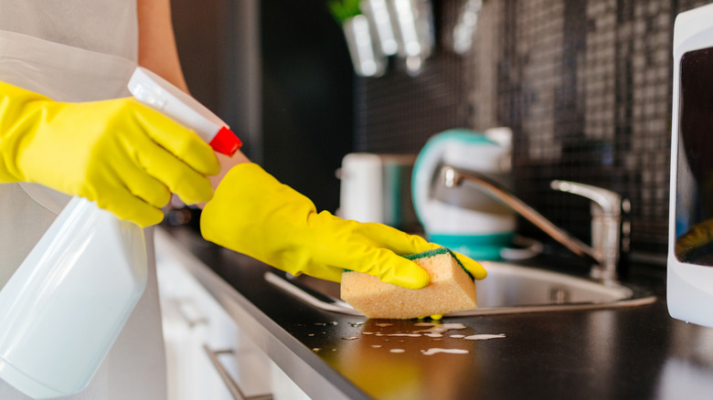 woman cleaning with sponge