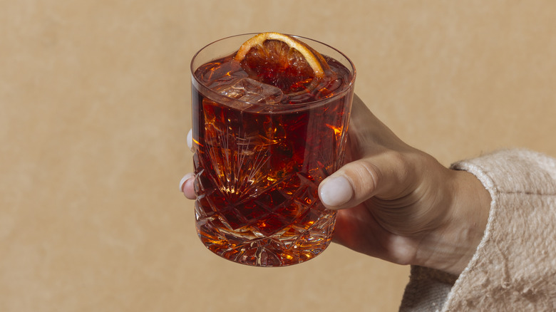 woman holding negroni