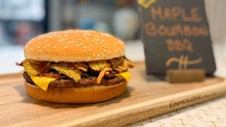 Burger King maple bourbon bbq Whopper on wooden board