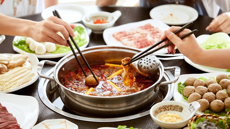 People around a hot pot table