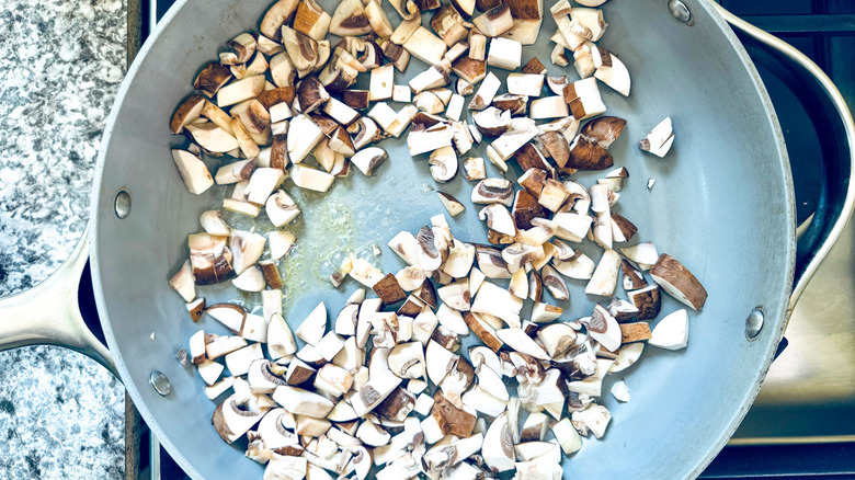 chopped mushrooms in metal pan