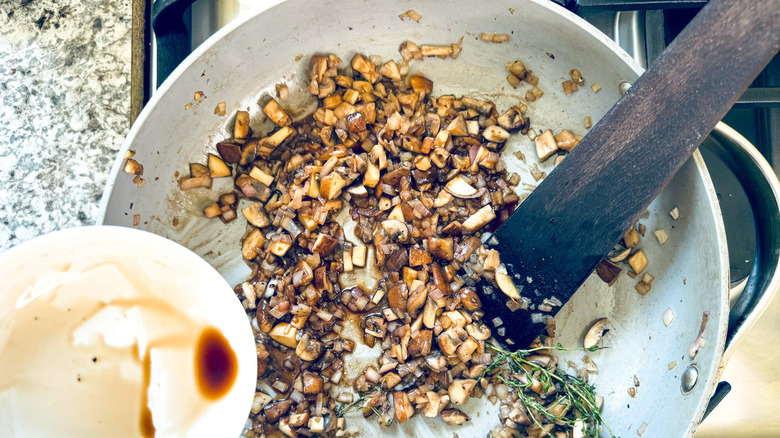 brown liquid hovering over pan