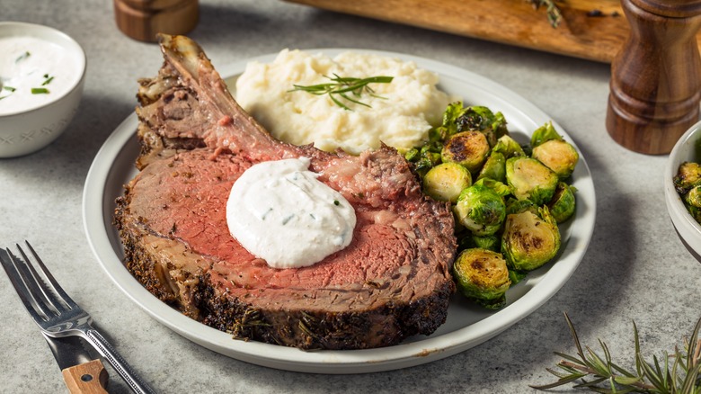 Serving of prime rib with sauce