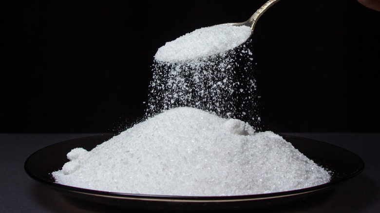 pile of salt with spoon