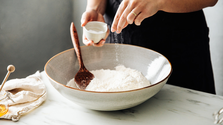 adding salt to dough