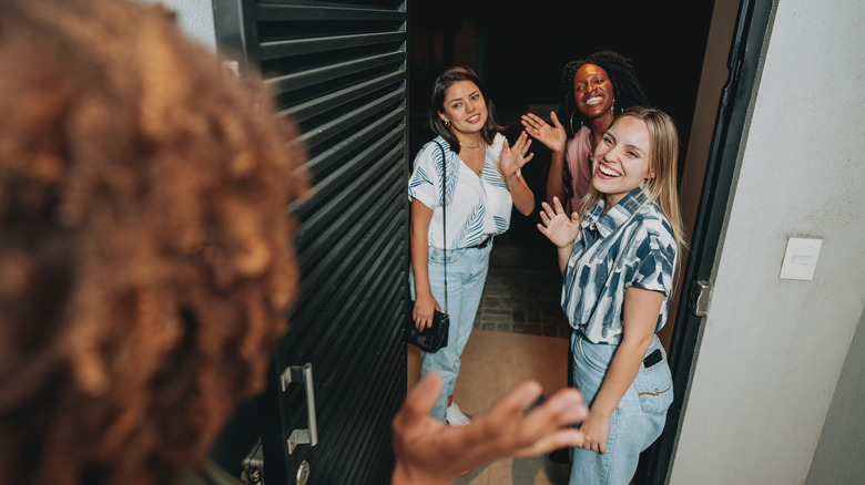 friends waving goodbye