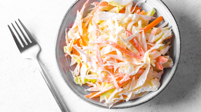 coleslaw on table with fork