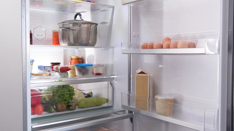 open refrigerator with different foods