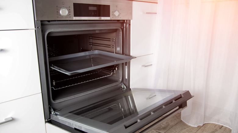 Empty oven with baking tray