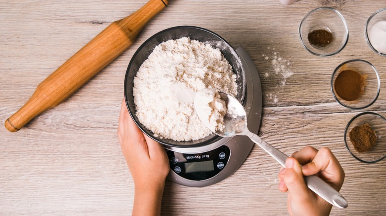 weighing flour on a scale