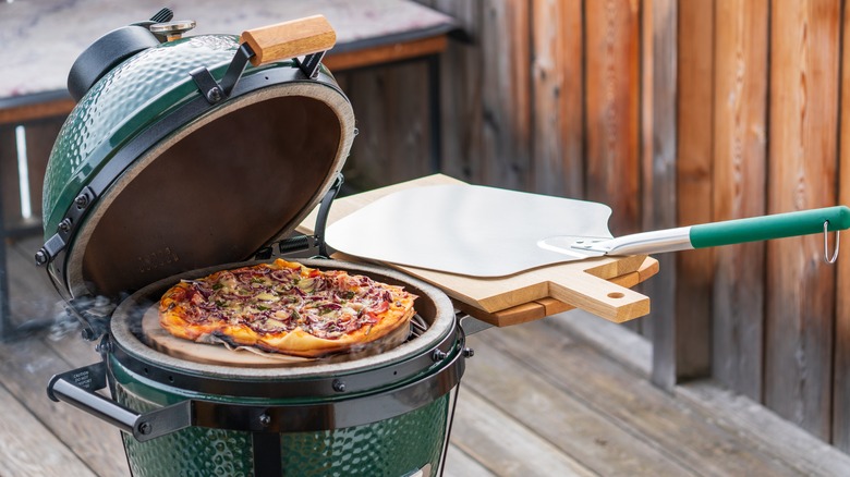 pizza on an outdoor grill 