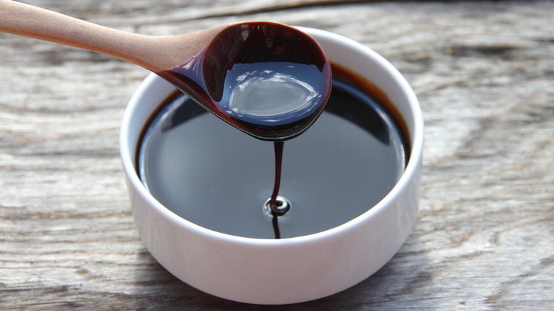 Molasses being poured into a bowl