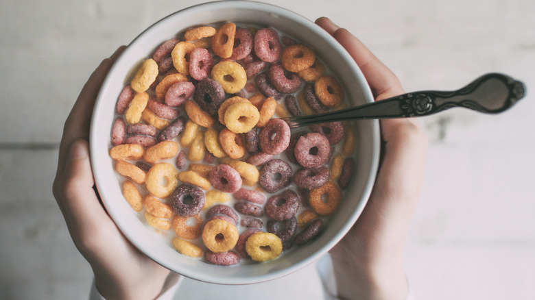 Holding bowl of fruity loops