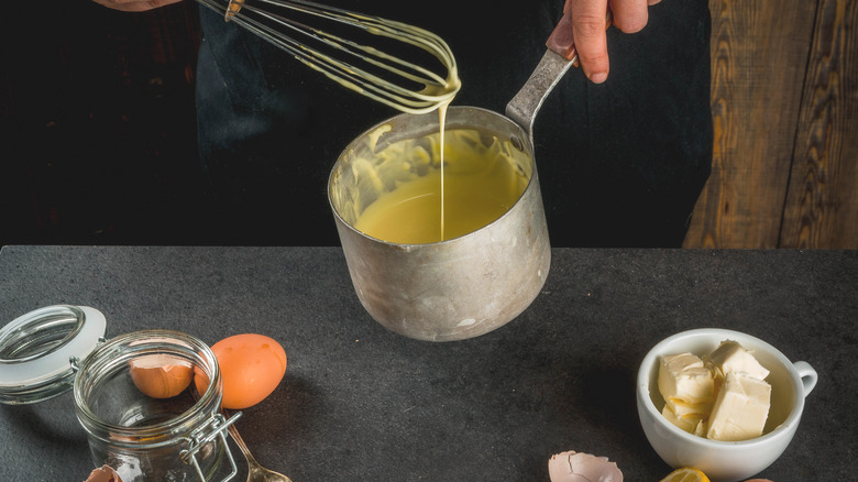 whisking butter into sauce