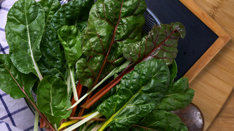 Mixed leafy greens on board