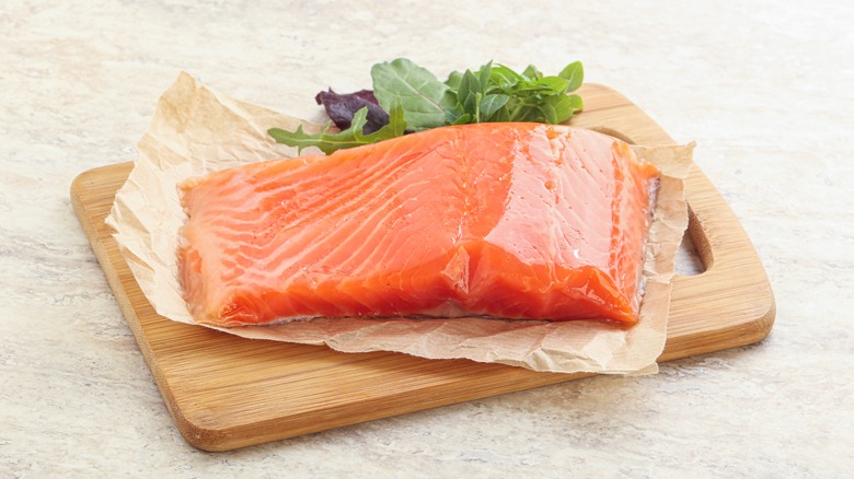 Fresh salmon on cutting board