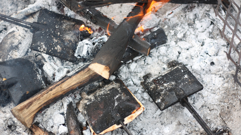 pie iron cooking over a fire