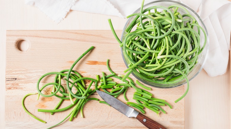 Garlic scapes being prepared