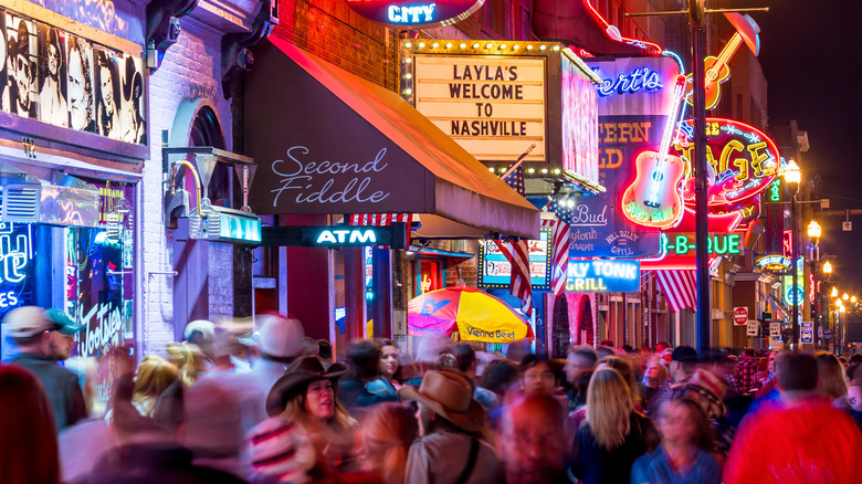 crowds walking along honky-tonk highway