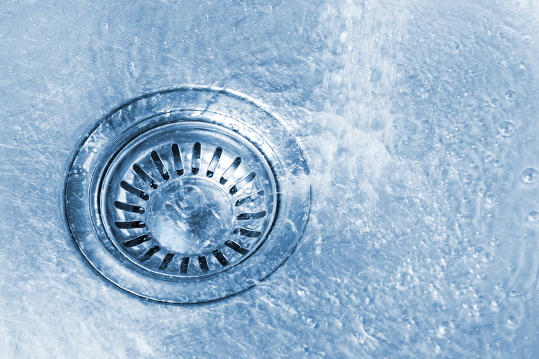 Use baking soda, vinegar and boiling water to unclog a drain