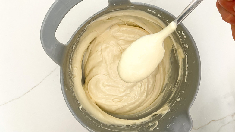 Cream cheese icing in a bowl