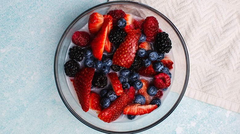 Berries and coconut water in bowl