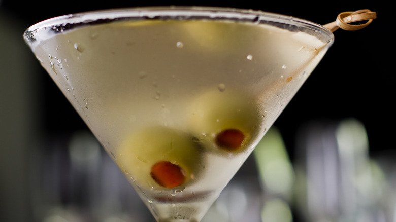 dirty martini with olive garnish