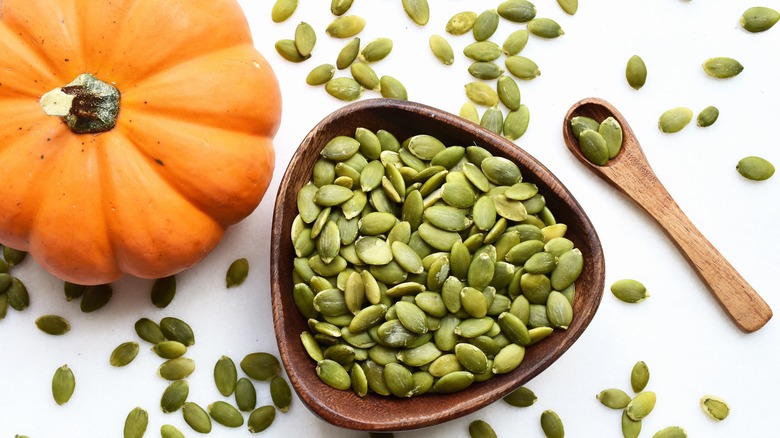 Pumpkin seeds in a wooden bowl