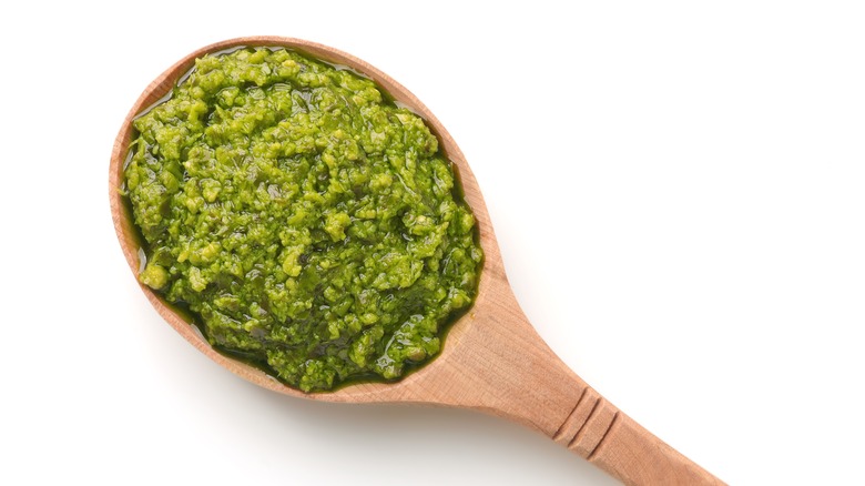 Pesto sauce on a wooden spoon