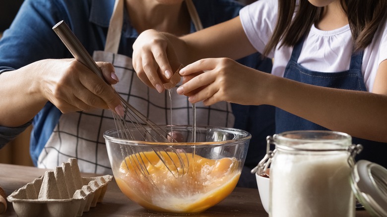 cracking egg into bowl