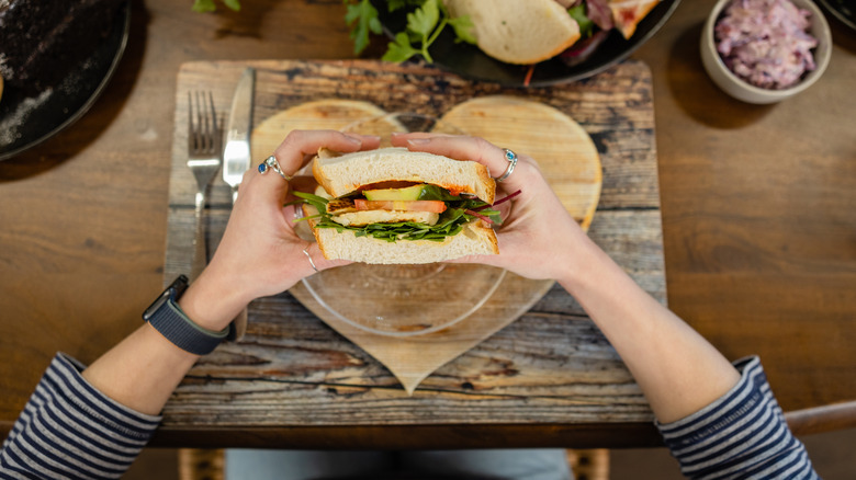 person eating a sandwich