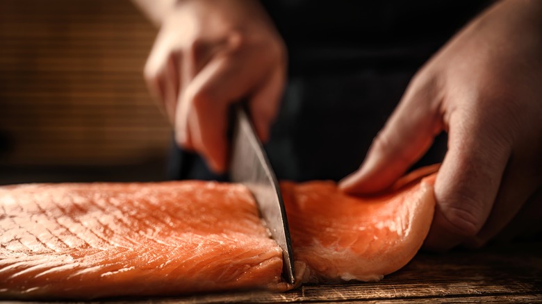 Cutting salmon filet