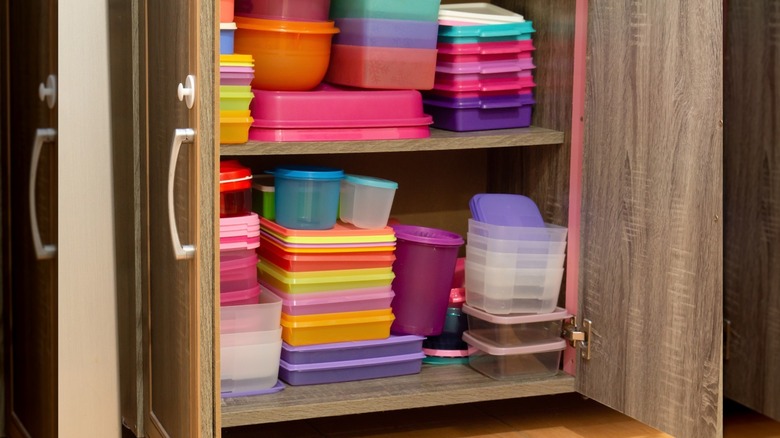 food containers organized in cupboard