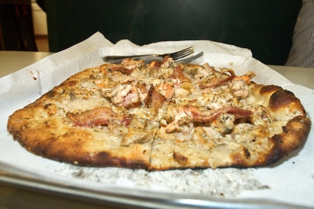 Clam pie, "no mozz," with bacon.