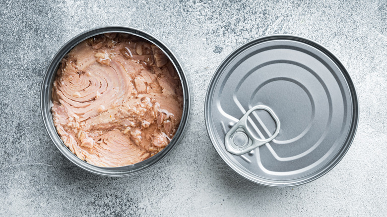 Two cans of tuna with one open