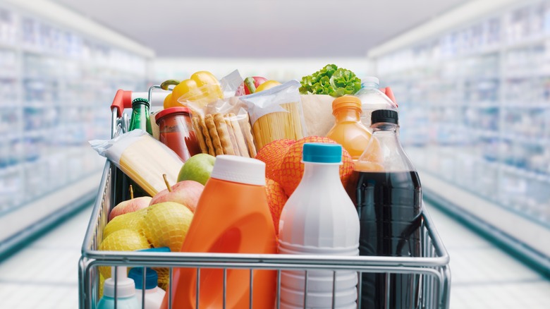 Shopping cart filled with food and drinks 